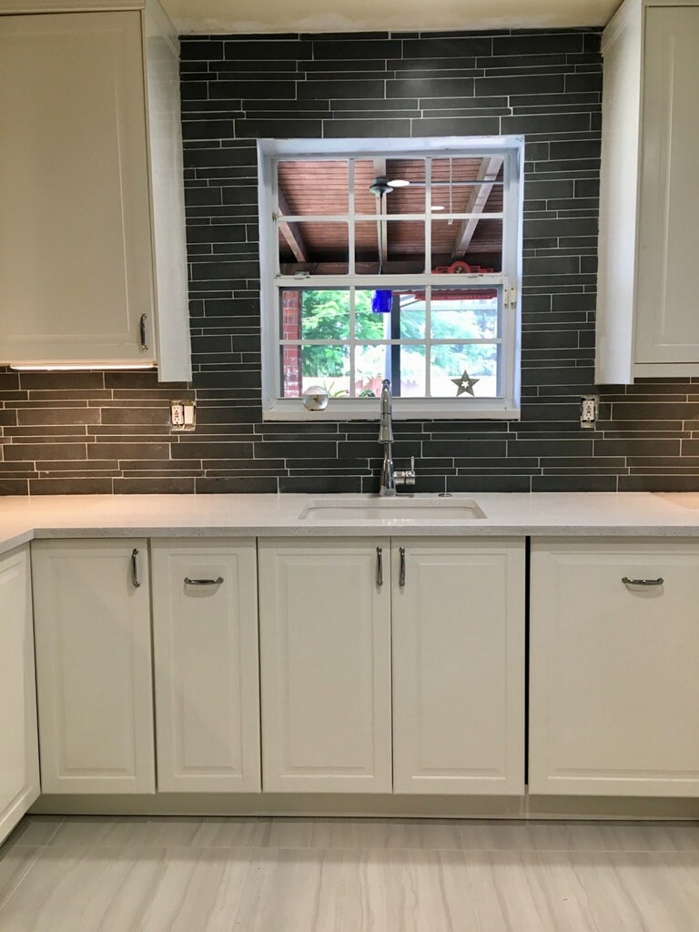 Norstone Ash Grey Lynia Interlocking Tile used as a backsplash tile going from counter top to ceiling in a project in South Florida.